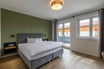 Ein Bett oder Betten in einem Zimmer der Unterkunft Hotel Baumann