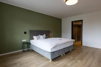 Ein Bett oder Betten in einem Zimmer der Unterkunft Hotel Baumann