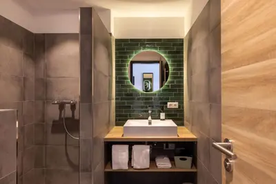 Ein Badezimmer in der Unterkunft Hotel Baumann
