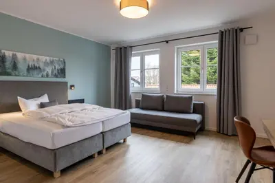 Ein Bett oder Betten in einem Zimmer der Unterkunft Hotel Baumann