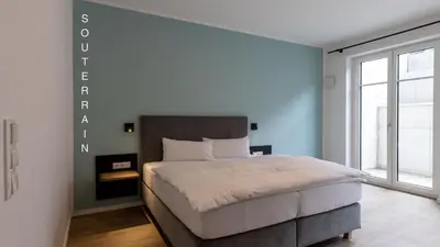 Ein Bett oder Betten in einem Zimmer der Unterkunft Hotel Baumann