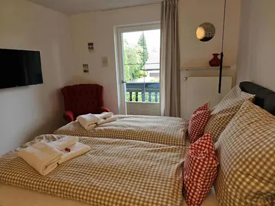 Ein Bett oder Betten in einem Zimmer der Unterkunft Ferienwohnung Messinger