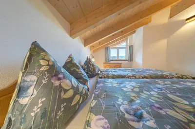 Ein Bett oder Betten in einem Zimmer der Unterkunft Ferienwohnungen Zum Bachl - Karwendelblick