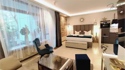 Ein Bett oder Betten in einem Zimmer der Unterkunft HOMELY STAY Studio P1 - Elegant Self-Check-in Studio-Apartment in Munich -with Kitchen and Washing Machine