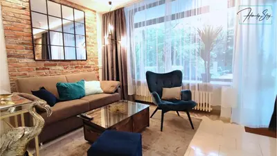 Ein Sitzbereich in der Unterkunft HOMELY STAY Studio P1 - Elegant Self-Check-in Studio-Apartment in Munich -with Kitchen and Washing Machine