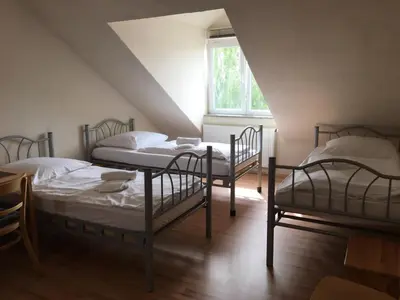 Ein Bett oder Betten in einem Zimmer der Unterkunft Pension Alis Augsburg