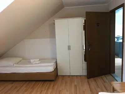 Ein Bett oder Betten in einem Zimmer der Unterkunft Pension Alis Augsburg