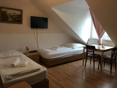 Ein Bett oder Betten in einem Zimmer der Unterkunft Pension Alis Augsburg