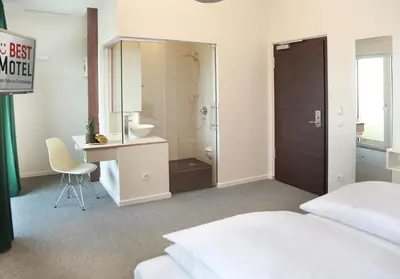 Ein Bett oder Betten in einem Zimmer der Unterkunft Best Motel