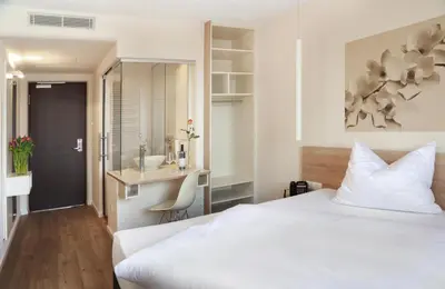 Ein Bett oder Betten in einem Zimmer der Unterkunft Best Motel