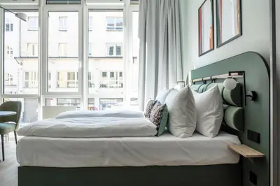 Ein Bett oder Betten in einem Zimmer der Unterkunft Numa Munich Blend