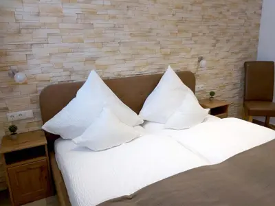 Ein Bett oder Betten in einem Zimmer der Unterkunft Zimmervermietung Huber