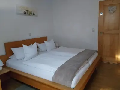 Ein Bett oder Betten in einem Zimmer der Unterkunft Zimmervermietung Huber