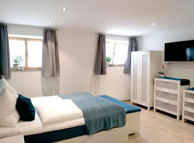Ein Bett oder Betten in einem Zimmer der Unterkunft Zimmervermietung Huber