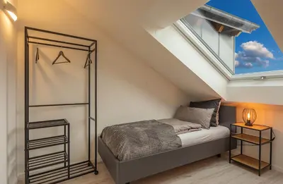 Ein Bett oder Betten in einem Zimmer der Unterkunft SweetHome - Poing Apartments