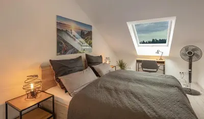Ein Bett oder Betten in einem Zimmer der Unterkunft SweetHome - Poing Apartments