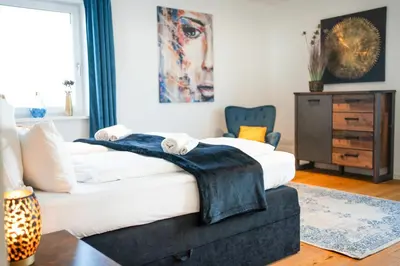 Ein Bett oder Betten in einem Zimmer der Unterkunft YAYstay - comfy Lofts in Rosenheim