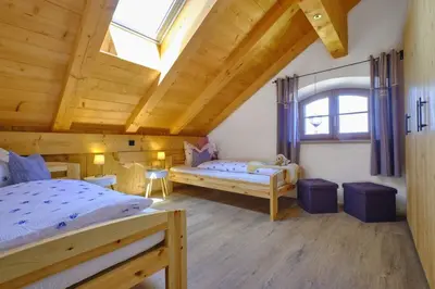 Ein Bett oder Betten in einem Zimmer der Unterkunft Huberhof Hinzing Ferienbauernhof