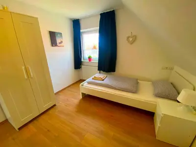 Ein Bett oder Betten in einem Zimmer der Unterkunft Ferienhaus Langweid