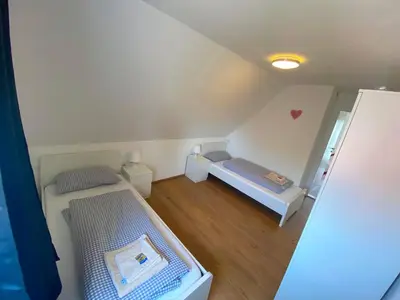 Ein Bett oder Betten in einem Zimmer der Unterkunft Ferienhaus Langweid