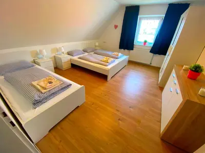 Ein Bett oder Betten in einem Zimmer der Unterkunft Ferienhaus Langweid