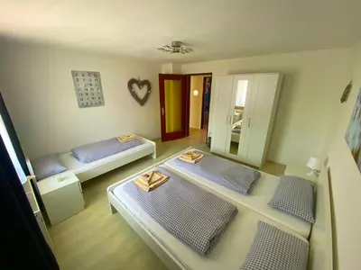 Ein Bett oder Betten in einem Zimmer der Unterkunft Ferienhaus Langweid