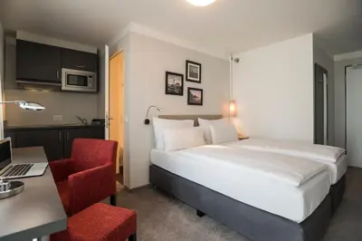 Ein Bett oder Betten in einem Zimmer der Unterkunft The Stay.residence