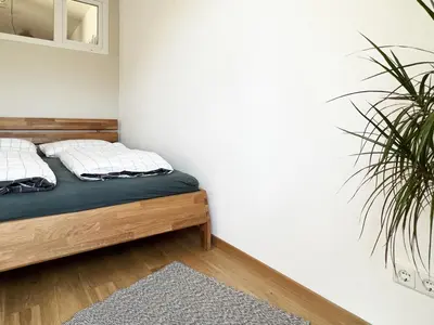 Ein Bett oder Betten in einem Zimmer der Unterkunft Moderne CityWohnung nahe Theresienwiese & Westpark