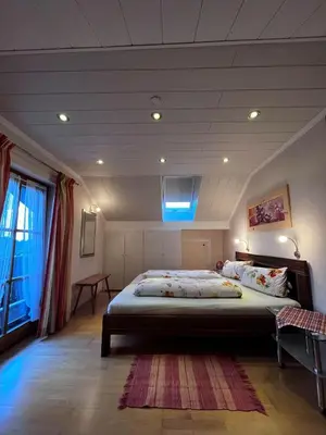 Ein Bett oder Betten in einem Zimmer der Unterkunft Gästehaus Mayer