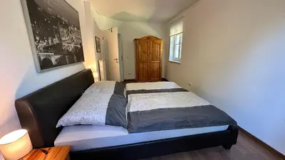 Ein Bett oder Betten in einem Zimmer der Unterkunft Ferienwohnung in Oberschondorf mit Terasse