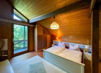 Ein Bett oder Betten in einem Zimmer der Unterkunft Ammergauer Ferienidyll