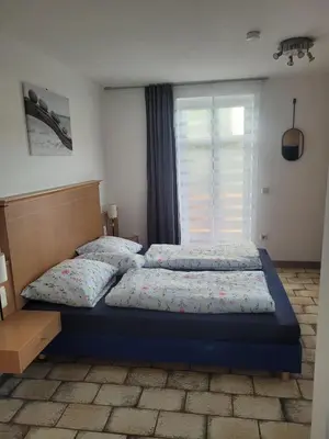 Ein Bett oder Betten in einem Zimmer der Unterkunft Alpenblick Pang