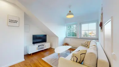 TV/Unterhaltungsangebot in der Unterkunft YUVA HOMES am Kurpark - BRIGHT Collection