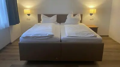 Ein Bett oder Betten in einem Zimmer der Unterkunft Gästezimmer Drexl