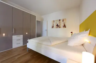 Ein Bett oder Betten in einem Zimmer der Unterkunft Business Suiten