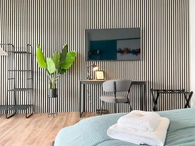 Ein Bett oder Betten in einem Zimmer der Unterkunft UNiQE - SKY-TV - 23 OG - Stadtblick - Kongress