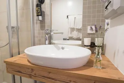 Ein Badezimmer in der Unterkunft Alpenhotel Dahoam