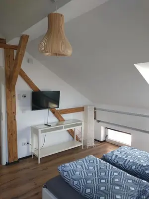 Ein Bett oder Betten in einem Zimmer der Unterkunft Bad Aibling City Apartment - Pano
