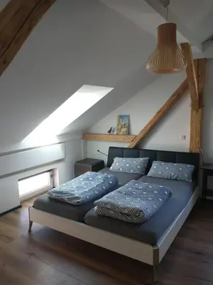 Ein Bett oder Betten in einem Zimmer der Unterkunft Bad Aibling City Apartment - Pano