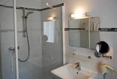 Ein Badezimmer in der Unterkunft Hotel Marienhof