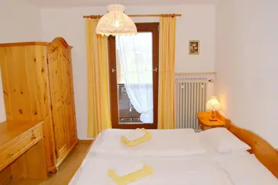 Ein Bett oder Betten in einem Zimmer der Unterkunft Alpenzauber