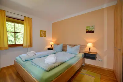 Ein Bett oder Betten in einem Zimmer der Unterkunft Ferienresidenz Chiemseestrand - Apartment 14
