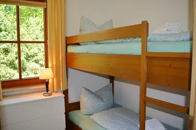 Ein Bett oder Betten in einem Zimmer der Unterkunft Ferienresidenz Chiemseestrand - Apartment 14