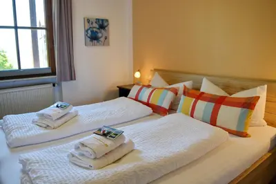 Ein Bett oder Betten in einem Zimmer der Unterkunft Ferienresidenz Chiemseestrand - Apartment 28