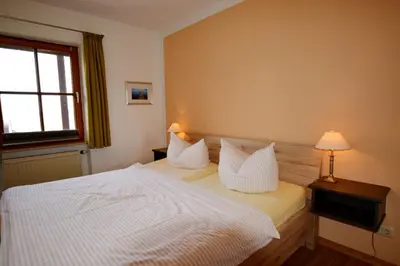 Ein Bett oder Betten in einem Zimmer der Unterkunft Ferienresidenz Chiemseestrand - Apartment 32