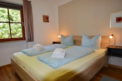 Ein Bett oder Betten in einem Zimmer der Unterkunft Ferienresidenz Chiemseestrand - Apartment 7