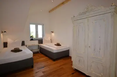 Ein Bett oder Betten in einem Zimmer der Unterkunft Meisterhof - Bergblick