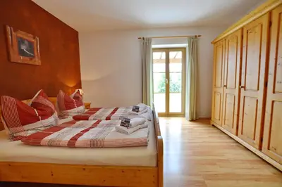 Ein Bett oder Betten in einem Zimmer der Unterkunft Meisterhof - Chiemsee