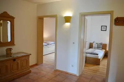 Ein Bett oder Betten in einem Zimmer der Unterkunft Meisterhof - Chiemsee