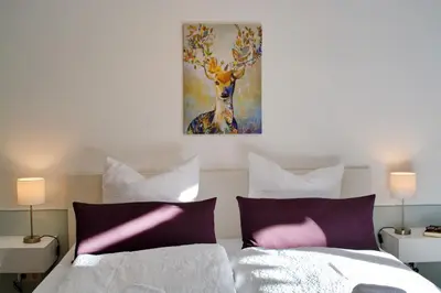 Ein Bett oder Betten in einem Zimmer der Unterkunft Sommerland